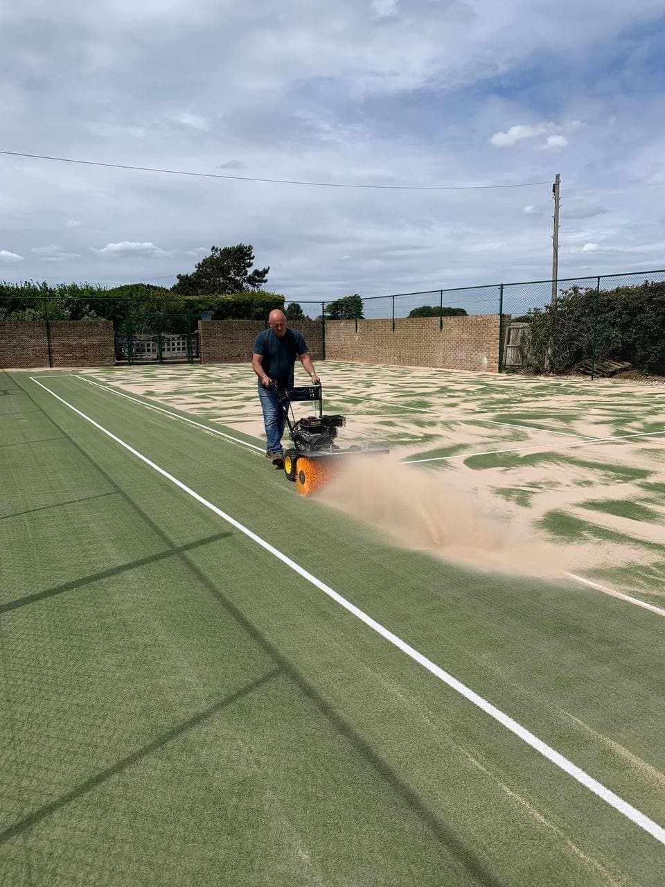 Refurbished tennis court service in Sussex